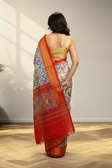 white and Golder Patola Saree