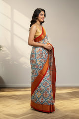 white and Golder Patola Saree