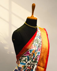 white and Golder Patola Saree