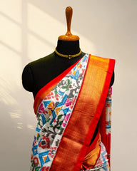 white and Golder Patola Saree