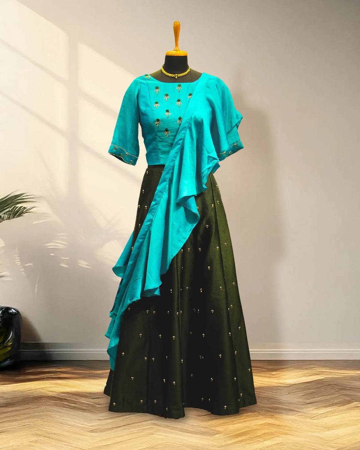 Green lehenga with half sleeve and with ruffles duppata