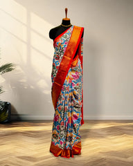 white and Golder Patola Saree